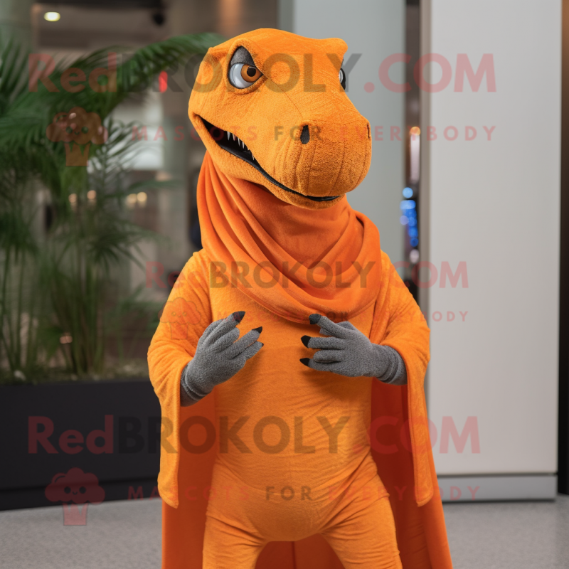 Orange Allosaurus mascot costume character dressed with a Skinny Jeans and Shawl pins
