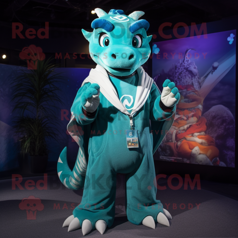 Teal Dragon mascot costume character dressed with a Sweatshirt and Rings