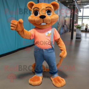 Peach Jaguarundi mascot costume character dressed with a Skinny Jeans and Gloves