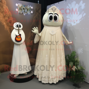 Beige Shakshuka mascot costume character dressed with a Wedding Dress and Brooches