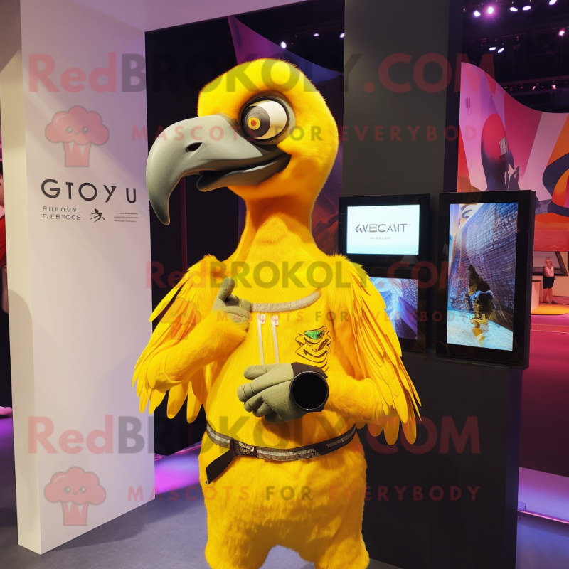 Yellow Vulture mascot costume character dressed with a Playsuit and Smartwatches