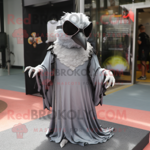 Silver Crow mascot costume character dressed with a Empire Waist Dress and Sunglasses