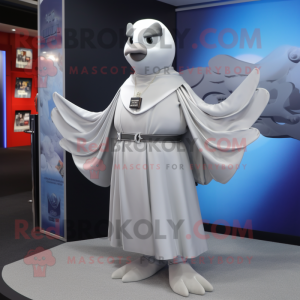 Silver Dove mascot costume character dressed with a Cover-up and Belts